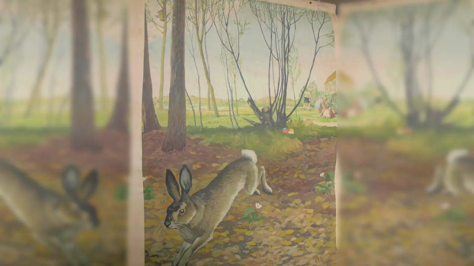 Im Heimatmuseum Dorfen ist ein altes Schulbild zu sehen, das den Osterhasen zeigt, wie er gerade den Kindern Ostereier ins Osternest gelegt hat. (Foto: VA)