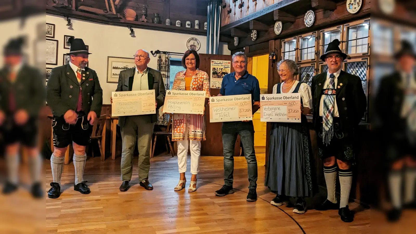 Spendenübergabe: v.l. Markus Abenthum sen., Hubert Langer, Anja Böhm, Wolfgang John, Gundi Lammerer und Mick Pedley. (Foto: Heimat- und Trachtenverein Weilheim )
