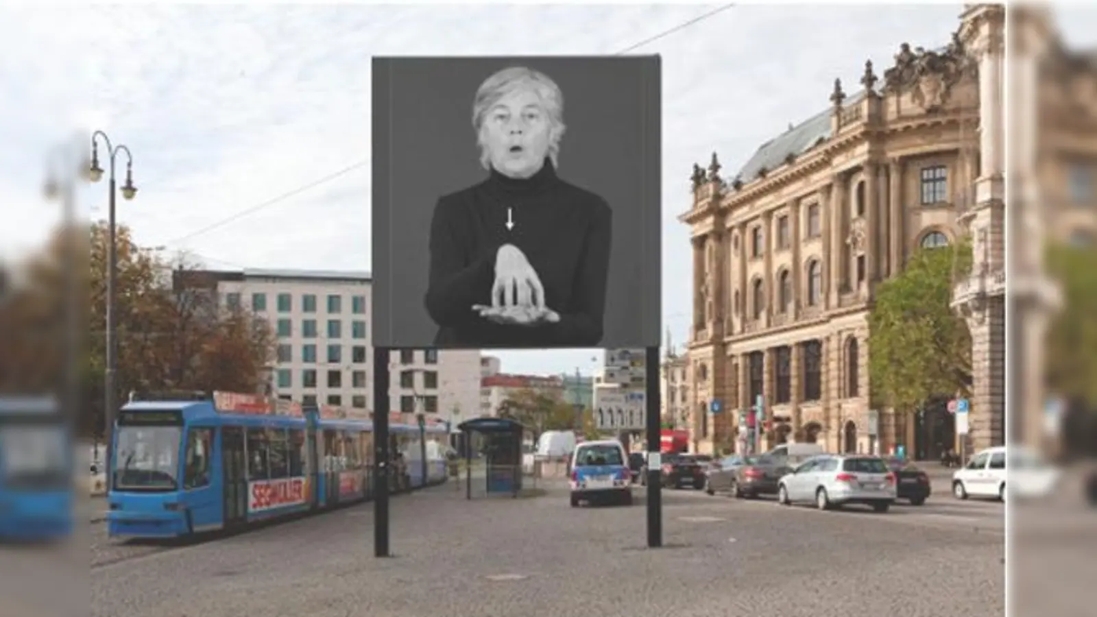 Münchner Gehörlose zeigen in Gebärdensprache den Weg  auf der Kunst-Insel am Lenbachplatz.	 (F.: www.albertcoers.com)
