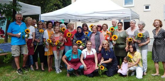 Sonnenblume für alle, die Sonne bringen: Ehrung der Ehrenamtlichen. 	Foto: Stadtmüller/VA