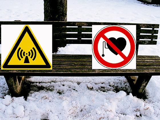 Notwendige Beschilderung für Sitzbänke unter Hochspannungsleitungen?: »Warnung vor elektromagnetischem Feld« und »Zugang für Träger von Herzschrittmachern untersagt« (rechts). Fotomontage: aha